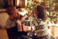 Romantic surprise holiday Ã¢â¬â Cheerful couple with gift enjoying